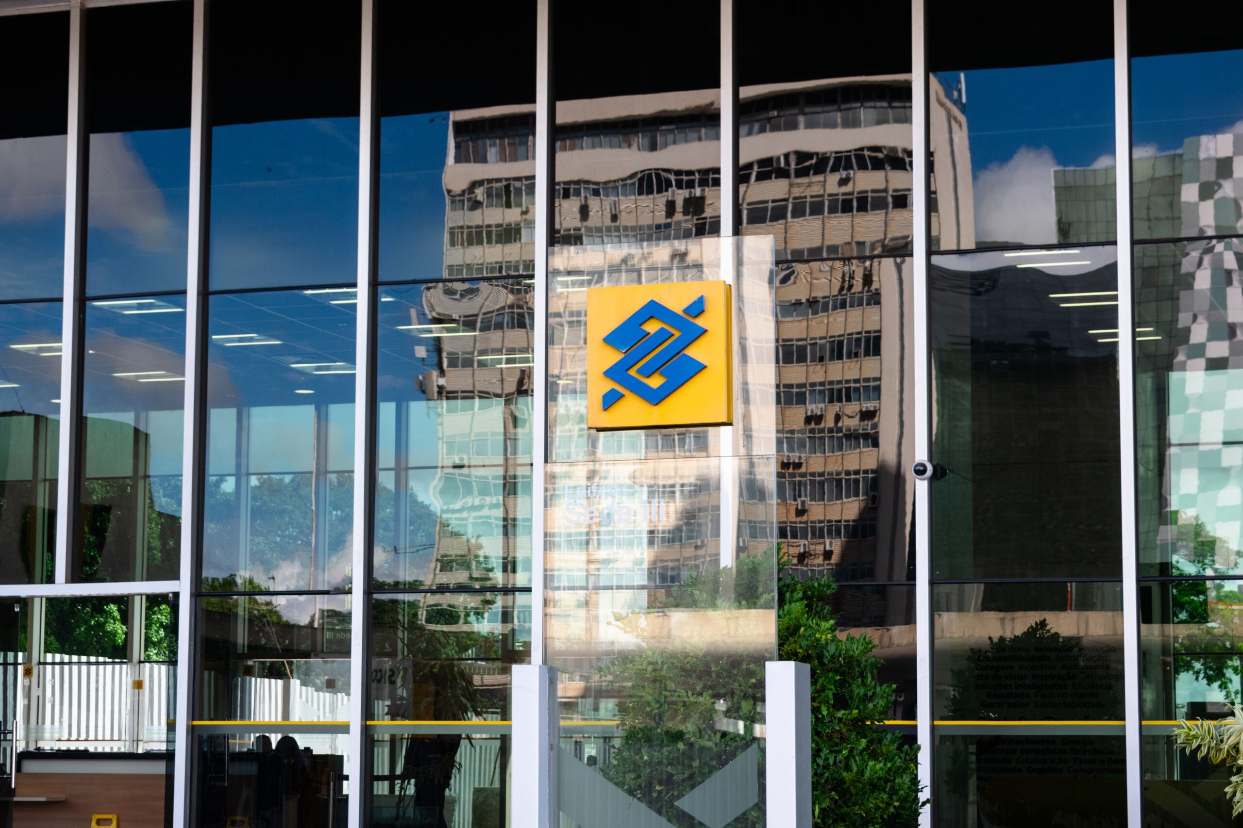 Modern building exterior in Brasília, Brazil, featuring reflective glass and iconic Banco logo.